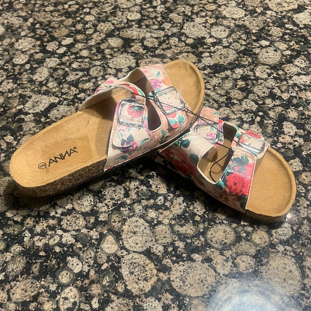 Brand new slides. Floral print. Size 9 in women’s.